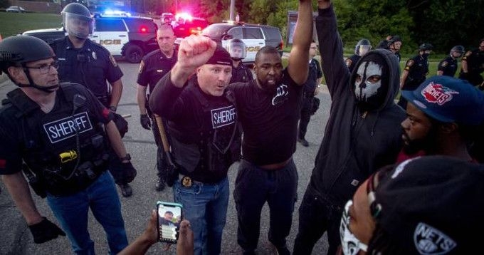 Police Officers Join Protesters Marching Against Brutality In Some Cities